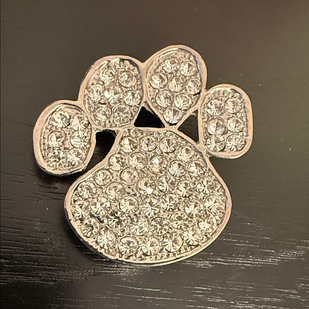 paw print pendant brooch featuring pave rhinestones in a silver-tone setting
